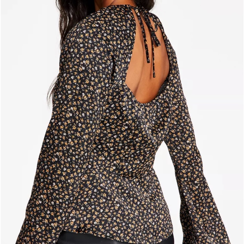 New with tags -alluring peplum top from LEYDEN. Sweetheart neckline